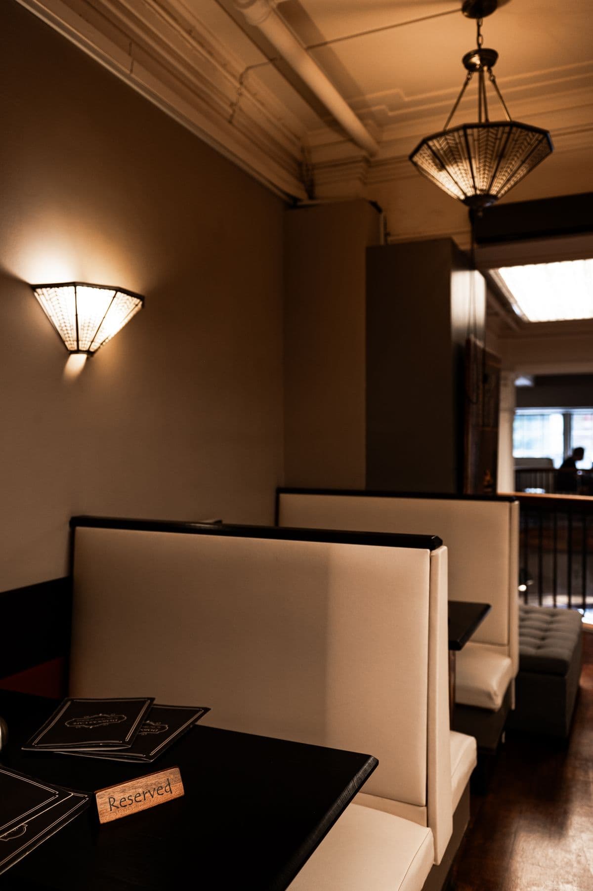 Leather booth seating with pendant lighting